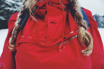 Midsection of women standing outdoors during winter