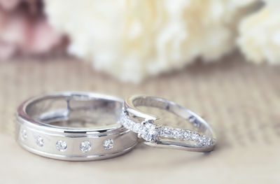 Close-up of wedding rings on table