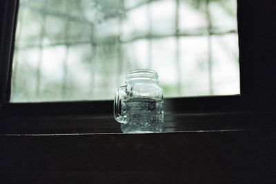 Close-up of glass jar on table