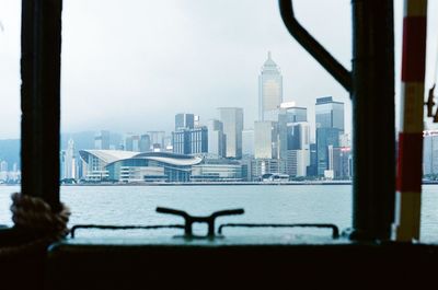 Buildings in city against clear sky