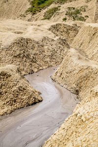 Mud volcanoes's clay river, closeup view. buzau county, romania.