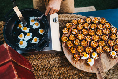 High angle view of person preparing food on table