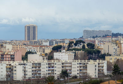 Buildings in city against sky