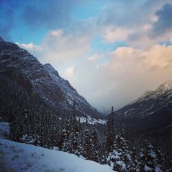 Scenic view of snow covered mountains against sky