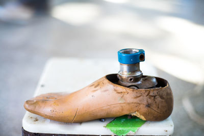 High angle view of faucet in container