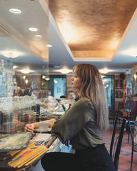 Side view of woman at restaurant