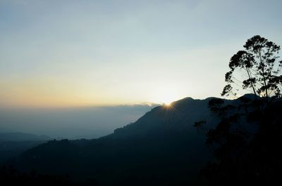 Scenic view of mountains at sunset