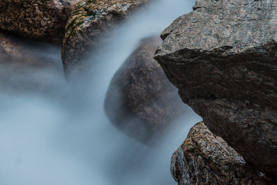 Scenic view of waterfall against sky