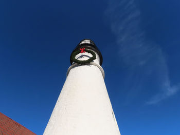 Low angle view of statue against blue sky