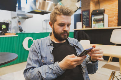 Young man using phone