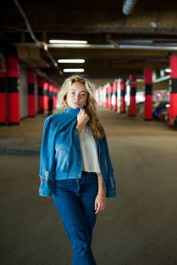 Portrait of woman standing in basement