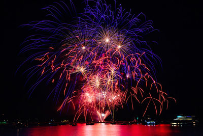 Firework display at night