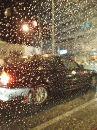 Waterdrops on glass at night