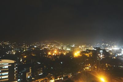 Illuminated cityscape at night