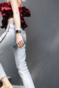 Low section of woman standing on floor