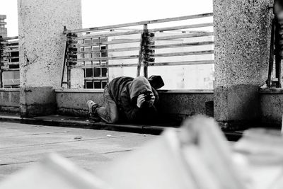 Man in front of building