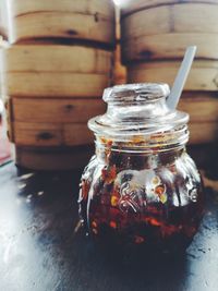 Close-up of preserves in glass jar on table