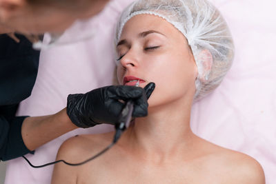 Midsection of woman with eyes closed