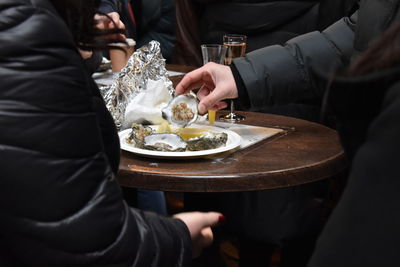 People eating oysters