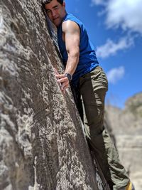 Midsection of man on rock