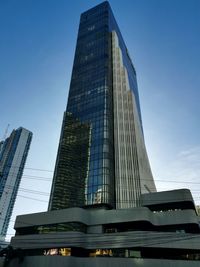 Low angle view of modern buildings against clear sky