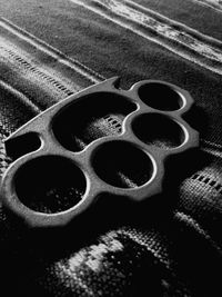 Close-up of brass knuckle on carpet