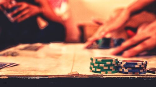 Close-up of hands playing on table