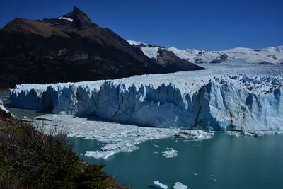 Scenic view of frozen lake against sky