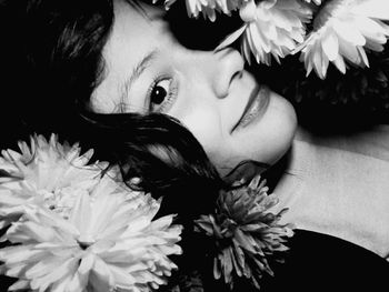 Close-up of woman holding flower