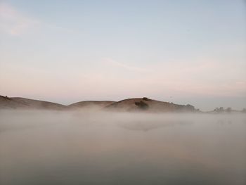 Scenic view of mountain against sky during sunset