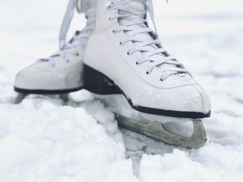 Shoes on snow covered field