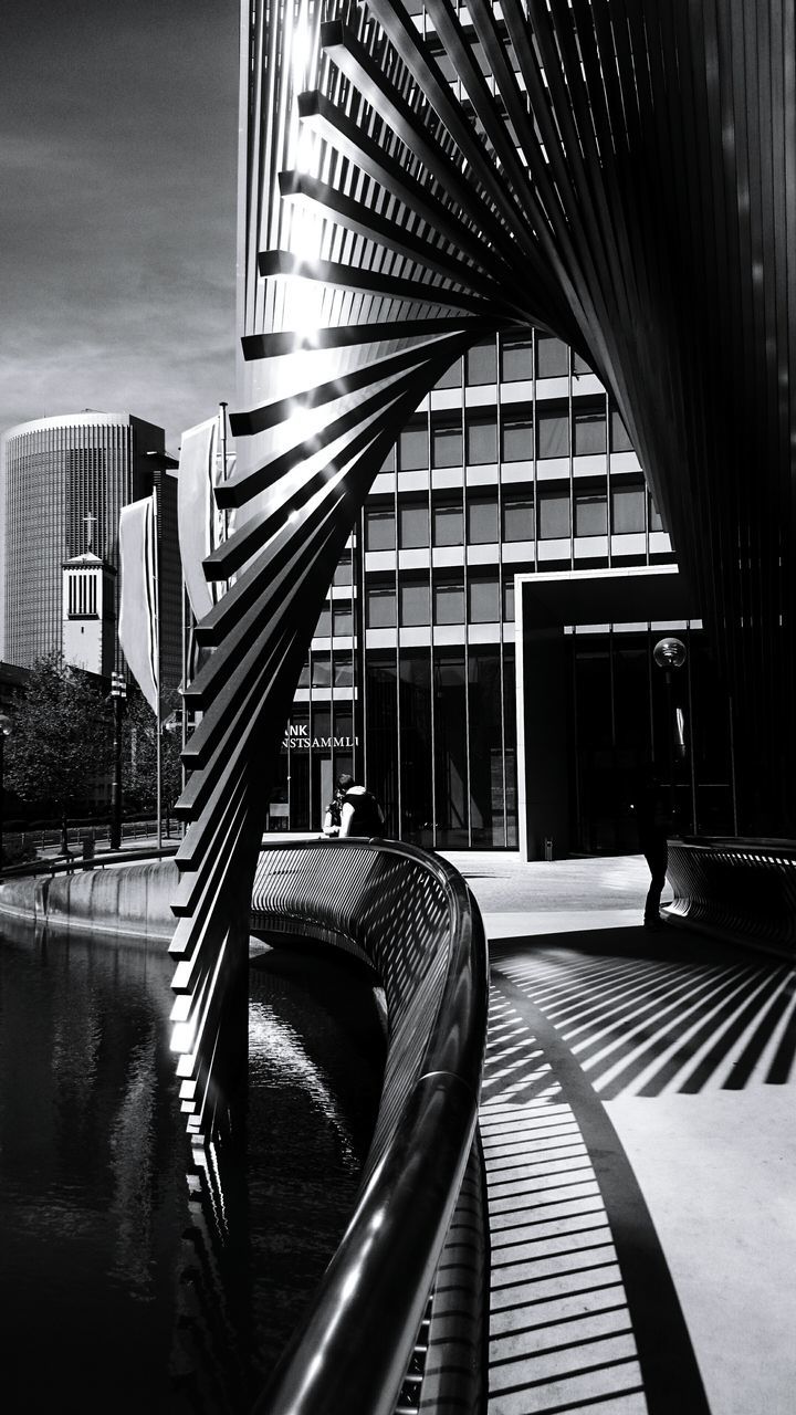 architecture, built structure, building exterior, railing, indoors, steps, window, modern, reflection, staircase, building, steps and staircases, sunlight, glass - material, chair, balcony, day, absence, city, no people