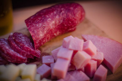 Close-up of sliced and chopped meat on cutting board