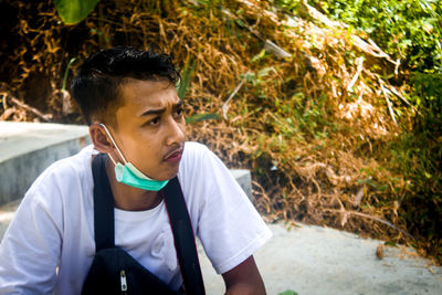 Portrait of young man looking away