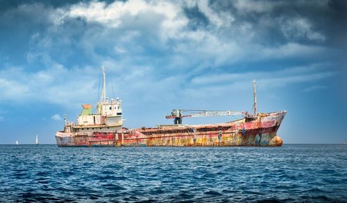 Ship in sea against sky