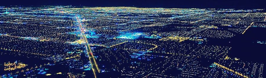 Aerial view of illuminated city at night