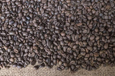 Close-up of roasted coffee beans on burlap
