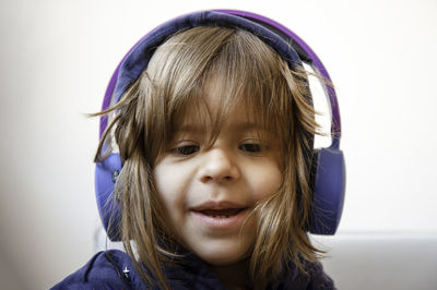 Portrait of a smiling girl against white background