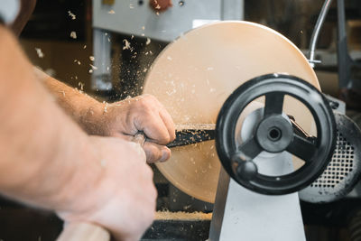 Close-up of man working in factory