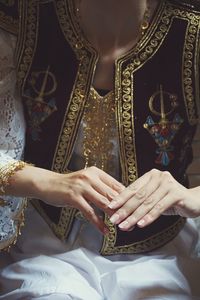 Midsection of bride in traditional clothing