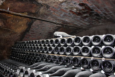 Old abandoned champagne bottles in cave