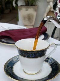 Having coffee in a tea cup at my uncles bed and breakfast in merida mexico.