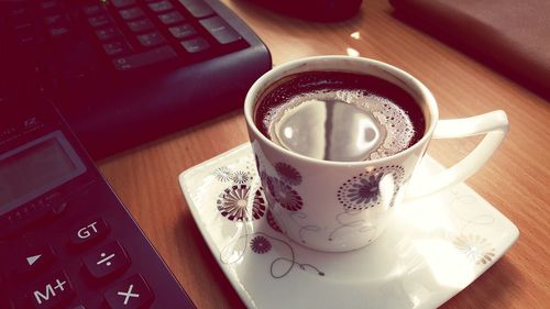 High angle view of coffee cup on table