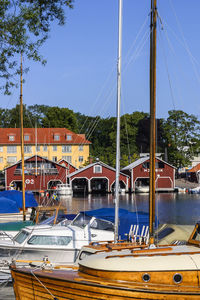 Pleasure boats and red boathouse in hjo, sweden