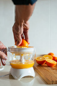 Midsection of man preparing food on table