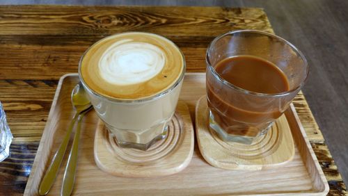 High angle view of coffee cups on table