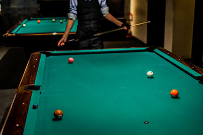 Man playing with ball on table