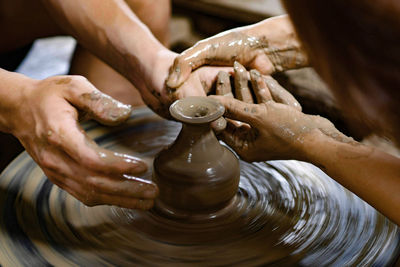 Midsection of woman working in mud