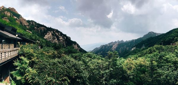 Scenic view of mountains against cloudy sky