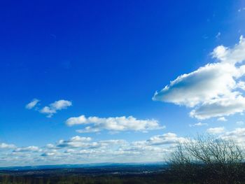 Scenic view of landscape against blue sky